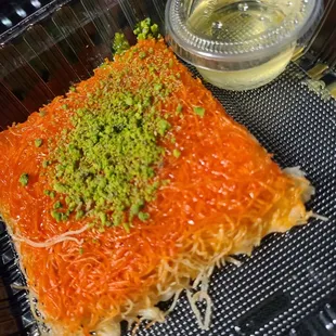 Knafeh with a side of syrup. Deliciously sweet and savory