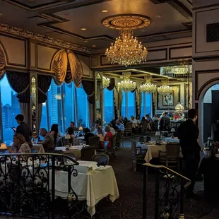 a dining room with chandeliers and chandeliers