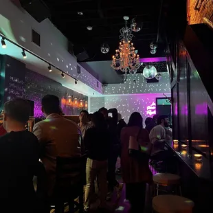 a crowd of people at a bar