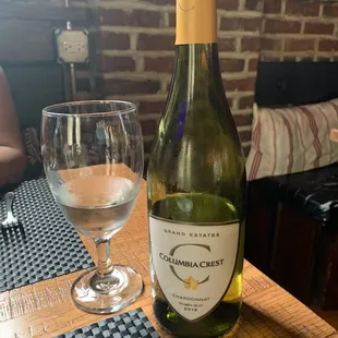 a bottle of wine and a glass