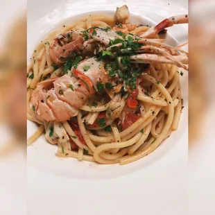 a plate of pasta with shrimp