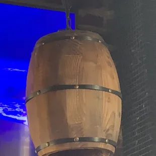 a wooden barrel hanging from the ceiling