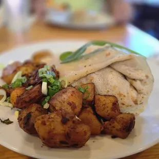 Chicken pesto crepe with homestyle potatoes.   $18