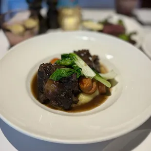 Queues de Boeuf au Vin Rouge: Braised oxtail, red wine, carrots, pomme puree ($35)