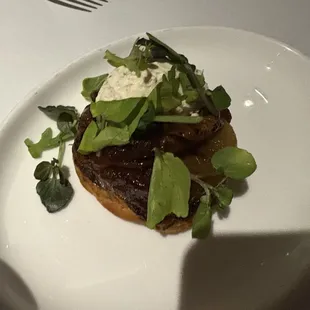 Part of the salmon tartare app, caramelized onions and cheese very good