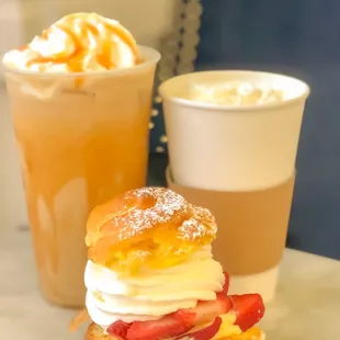 Iced Caramel Macchiato with added whip and caramel sauce, triple cappuccino added whip; no up charge here, and Strawberry Cream Puff.