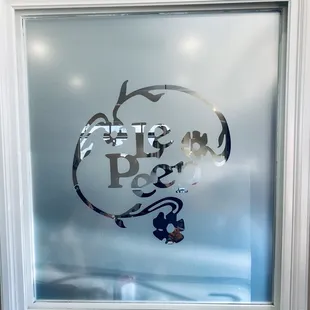 a glass window with a logo on it