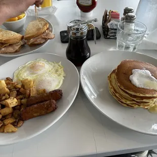 The logger: short stack pancakes, pork sausage, two eggs over easy, home fries.  And behind is the turkey club ( outstanding )