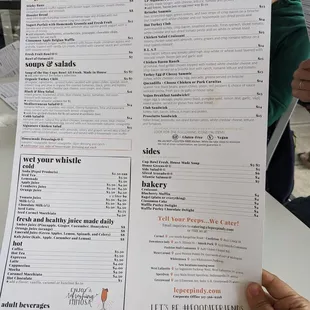 a person holding a menu
