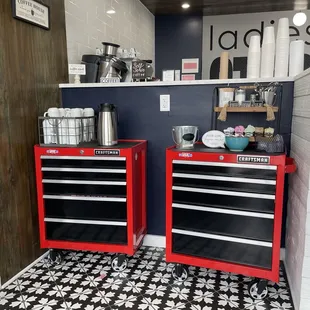 two red tool cabinets in a kitchen