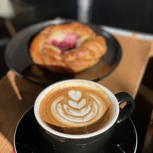 a cup of coffee and a pastry