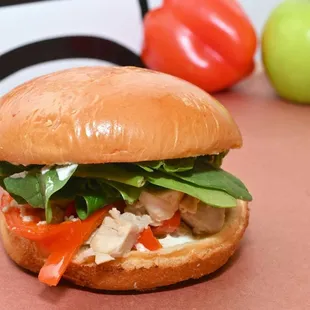 The Tuscan sandwich, seasoned grilled chicken with roasted red peppers fresh spinach and a homemade garlic lemon aioli.