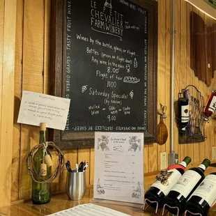 a chalkboard with wine bottles on it
