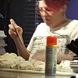 Restaurant owner scaling out pizza dough (11/16/22)