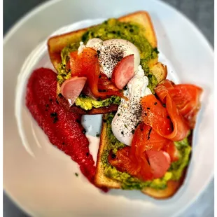 a plate of food with tomatoes and eggs