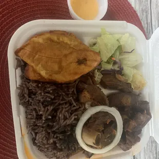 a meal in a styrofoam container