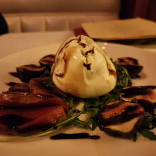 a plate of grilled meat and ice cream