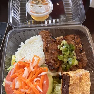 Grilled pork chops and rice plate. Came with fried tofu and fried shrimp cake. All delicious!