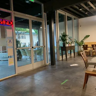 an empty restaurant with tables and chairs