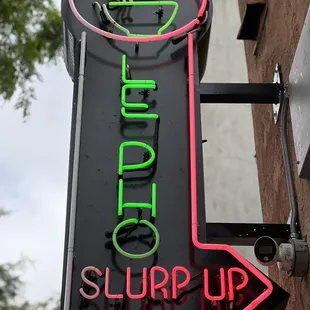 a neon sign for a restaurant