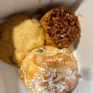 Pecan roll, chocolate almond croissant, and walnut chocolate chip cookie