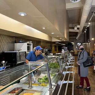 a man and a woman ordering food