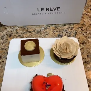 Tiramisu, caramel tart, and strawberry mousse with brownie.