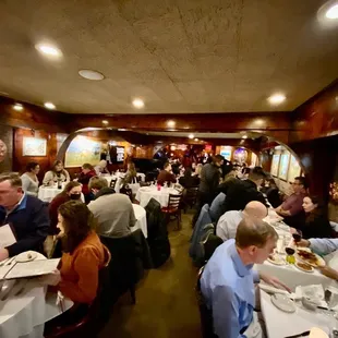 Inside with the famous composer/pianist with glasses in blue with the napkin
