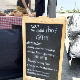 a chalkboard sign for a bakery