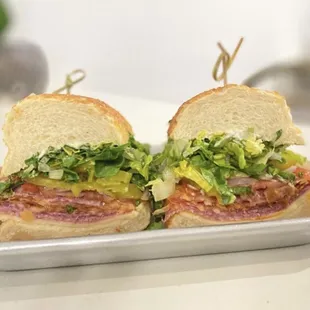 two halves of a sandwich on a tray