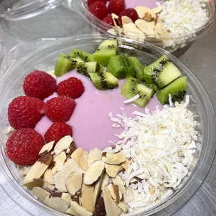 two bowls of fruit and nuts