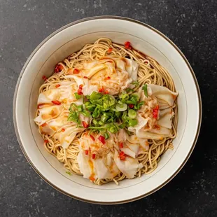 Tossed ramen in chili vinaigrette with dumplings.