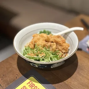 C4. Crispy Cod Dry Noodle: Crispy white cod, shredded cucumber, green onion, fried garlic, house sauce &amp; chili flakes | $ 15.75