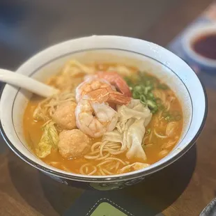 A1. Signature Trio Shrimp Noodle: prawn, ebiko prawn ball, prawn &amp; chicken wonton, 8-hour shrimp broth, cabbage &amp; green onion | $18.95