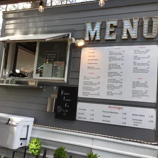a woman ordering food from a food truck