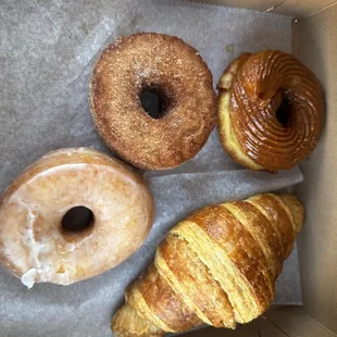 3 Donuts (French Cruller Caramel Spice, Butter Croissant, Croissant Cinnamon Sugar Donut and a regular glazed.