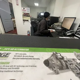 Shop "manager" trying to focus to type the bill from storing my car for a week and not work on it.