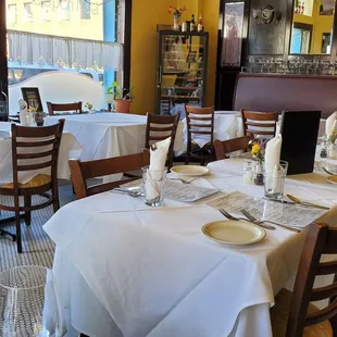a dining room with tables and chairs