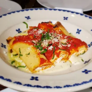 a plate of lasagna on a table