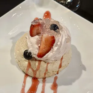a dessert with strawberries and blueberries