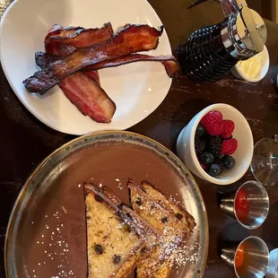 French toast with berries and a side of bacon