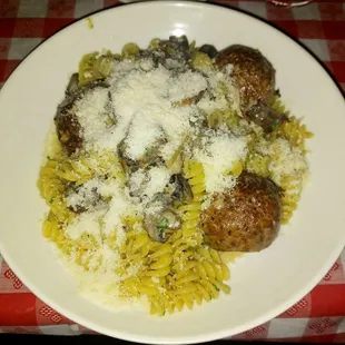Fusslli with chicken meatballs and creamy mushroom sauce, Parmesan cheese.