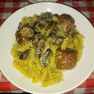 Fusslli with chicken meatballs and creamy mushroom sauce.