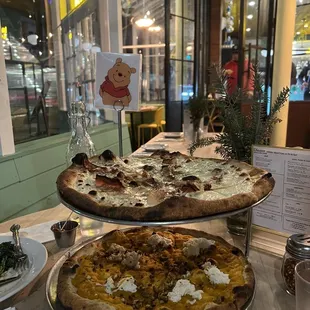 Happy hour pizzas - top is Wood-Fired Leek &amp; Bacon Pizza ($11.50) and bottom is Wood-Fired Butternut Squash Pizza ($11)
