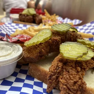 Jumbo Tenders. 2 piece tenders on white bread with pickles and fries