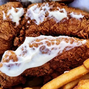 A close up of the chicken tenders inside the Plain Jane sandwich.