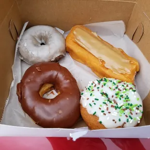 Blueberry cake, maple glazed long john, chocolate yeast, and sprinkle vanilla frosted