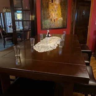 a dining room with a table and chairs