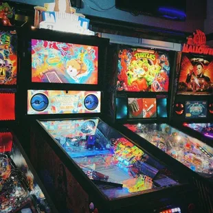 a row of pinball machines