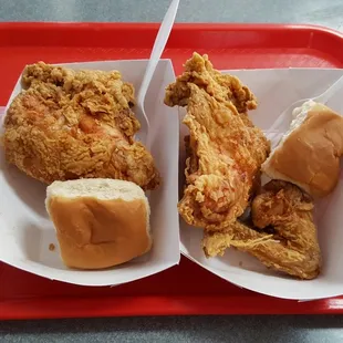 a tray of fried chicken and coleslaw